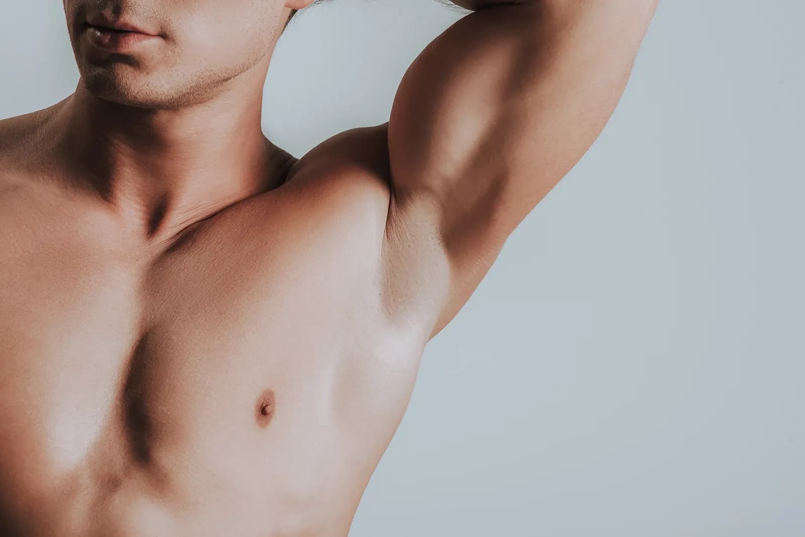 Male breast reduction showing removed excess glandular tissue — Empowered Plastic Surgery, Sugar Land TX